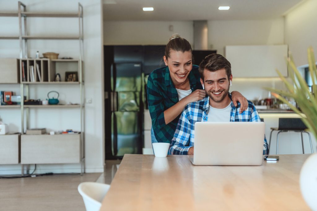 A young couple doing online research to find a high-quality Medicaid rehab in Indiana.